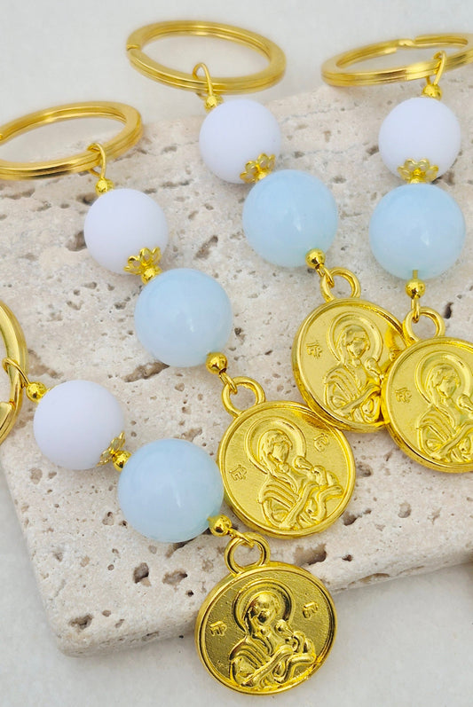 Xειροποίητα μαρτυρικά με εικόνα της Παναγίας λευκά baby blue πέλρες και χρυσές αποχρώσεις